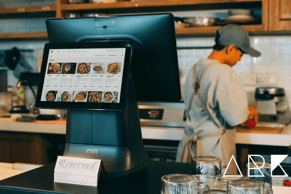 Restaurant manager using tablet